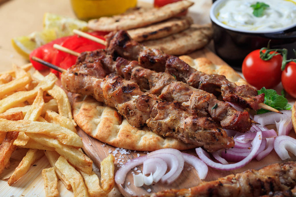 Grilled meat skewers on a pita bread - Photo, Image