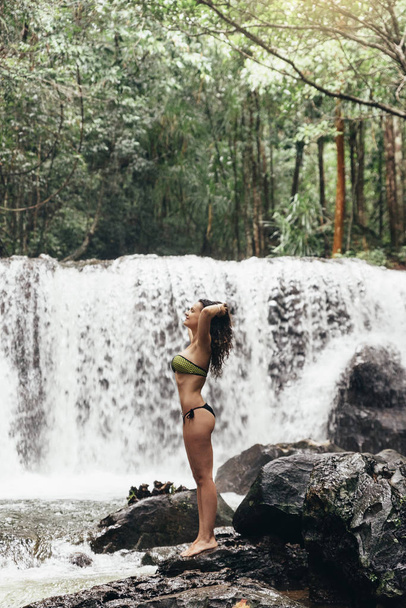Female model in nature waterfall. - Photo, Image
