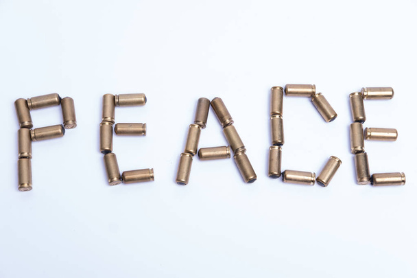 Word peace constructed from bullets. Abstract message. Top view. - Photo, Image
