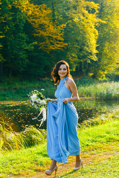 Beautiful young bridesmaid with curly hair - Fotografie, Obrázek