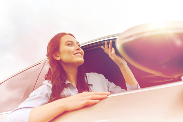 happy young woman driving in car - Fotoğraf, Görsel