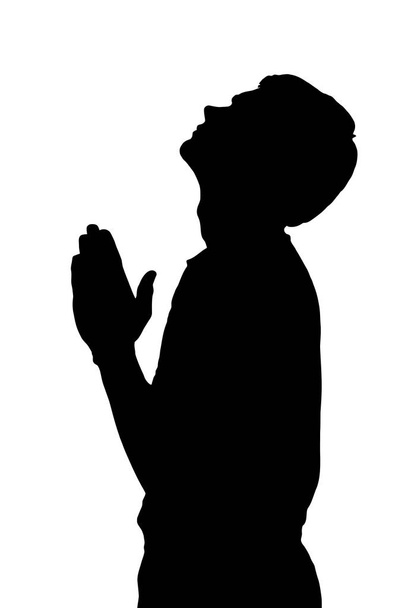Side profil portré sziluettje vallási tizenéves fiú prayin - Vektor, kép
