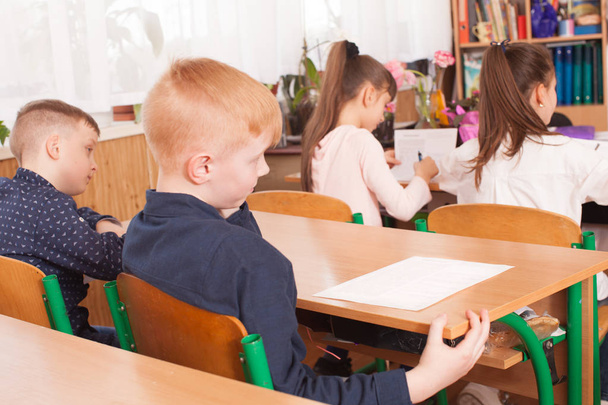 Children taking an exam - Foto, imagen