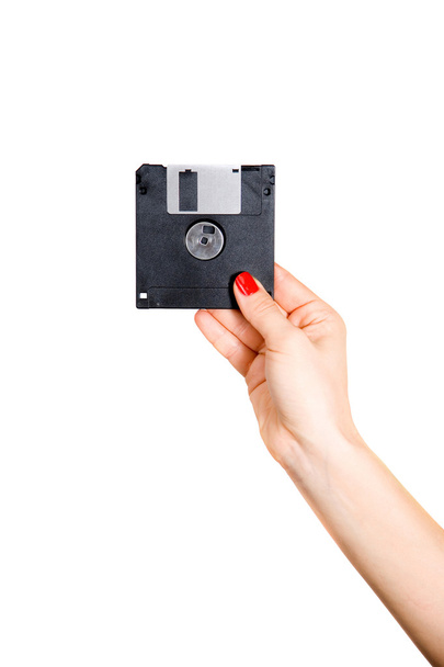 Hand mit Computer-Diskette isoliert auf weißem Hintergrund - Foto, Bild