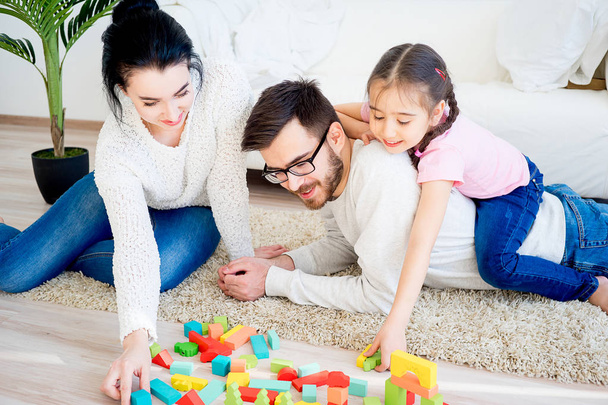 Family playing with toy blocks - Φωτογραφία, εικόνα
