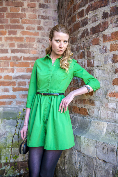 Blonde girl in lace dress in an old fortress - Fotografie, Obrázek