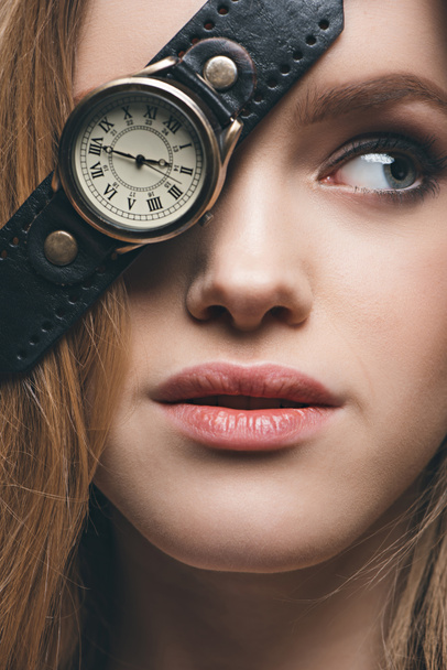 girl hiding eye with vintage watch - Фото, изображение