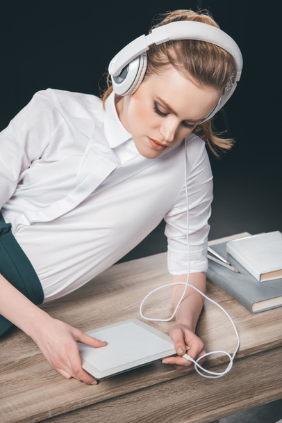 Blonde businesswoman in headphones  - Fotó, kép