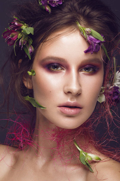 Beautiful girl with art make-up and flowers. beauty face. - Photo, image