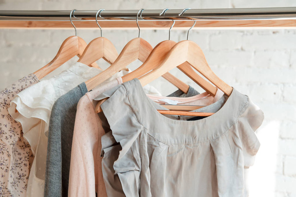 Clothes hang on clothing rack - Zdjęcie, obraz