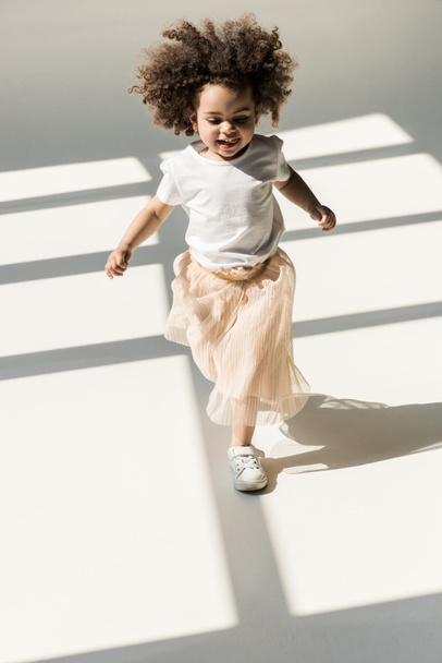 baby girl in white studio - Фото, изображение