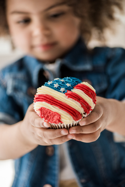 girl with american flag muffin - Photo, Image