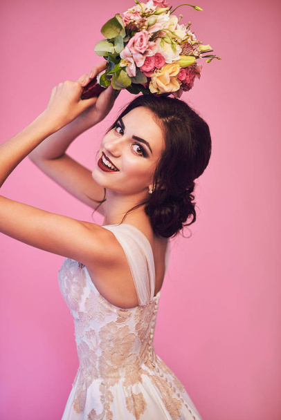 Brunet bride portrait in pink studio - Zdjęcie, obraz