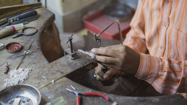 Indian Jeweler making an Oriental Jewelry in workshop. Handmade  - Fotografie, Obrázek