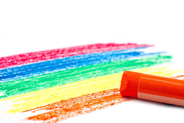 Rainbow color pattern and orange oil pastel on white background - Photo, Image