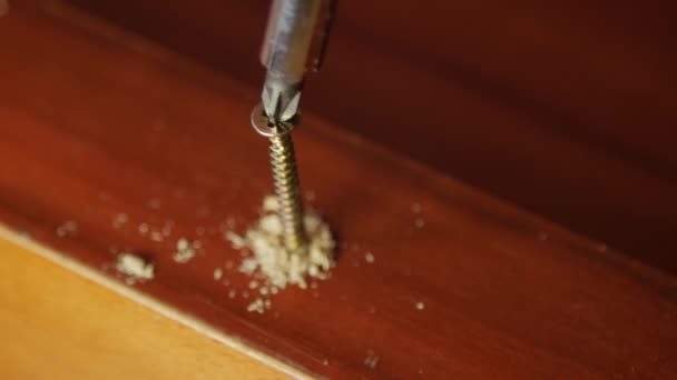 man drill hole in a wooden board - Footage, Video