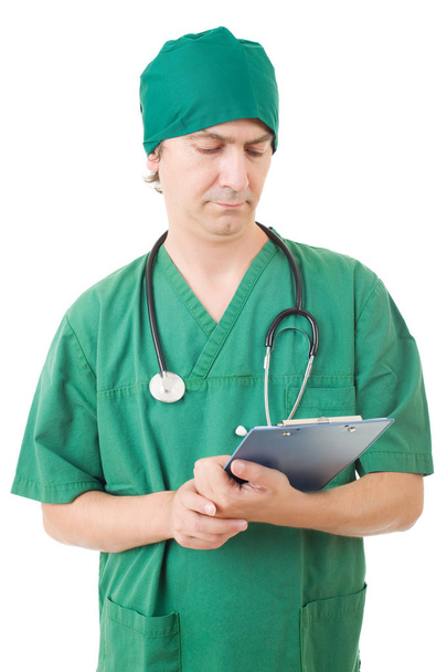 enfermera pensando con sus notas, aislado sobre fondo blanco
 - Foto, Imagen