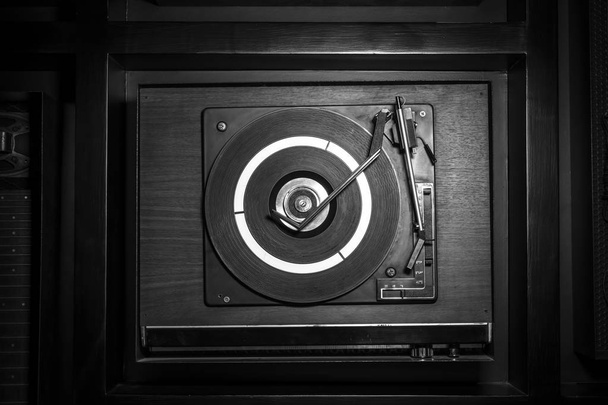 Top view of an old fashioned turntable playing a track from to o - Fotografie, Obrázek