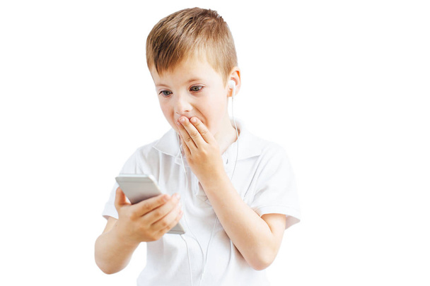 Little boy listen music and talk on phone with white background - Photo, Image