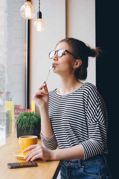 Girl in glasses drinking coffee  - Fotoğraf, Görsel