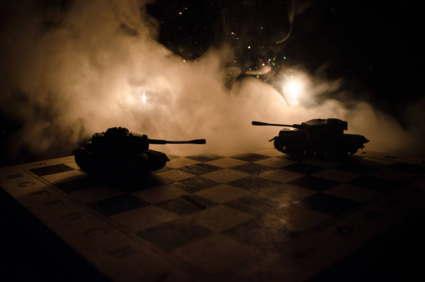 Tanks in the conflict zone. The war in the countryside. Tank silhouette at night. Battle scene. - Photo, Image
