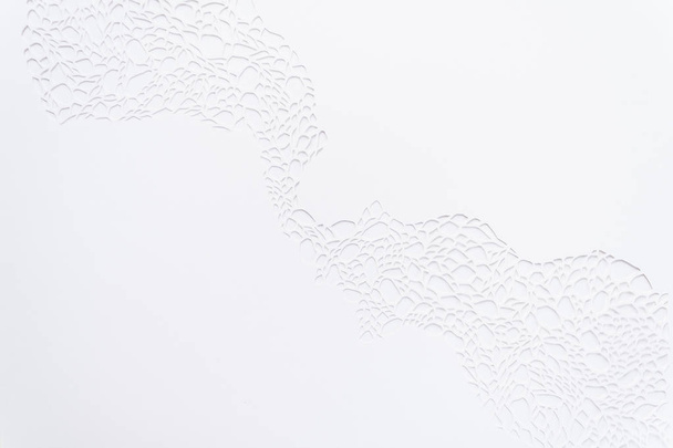 laser cutting, white background. Handmade cut paper - Fotó, kép