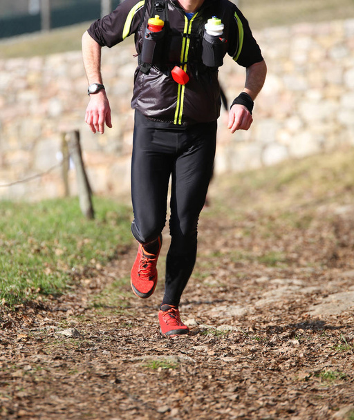 man runs with sportwear during a cross-country race - Photo, Image
