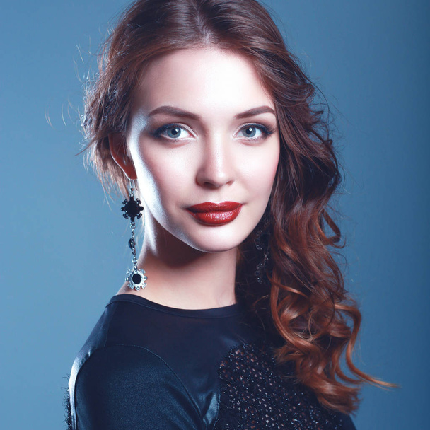 Beautiful woman with evening make-up in black dress - Photo, image
