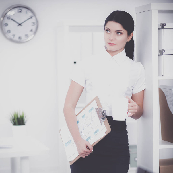 Portrait of a young woman working at office - Fotoğraf, Görsel