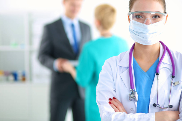 Woman doctor standing with stethoscope at hospital - Photo, Image
