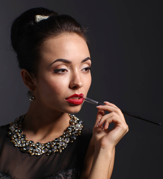 Portrait of young beautiful woman with jewelry - Foto, Imagen