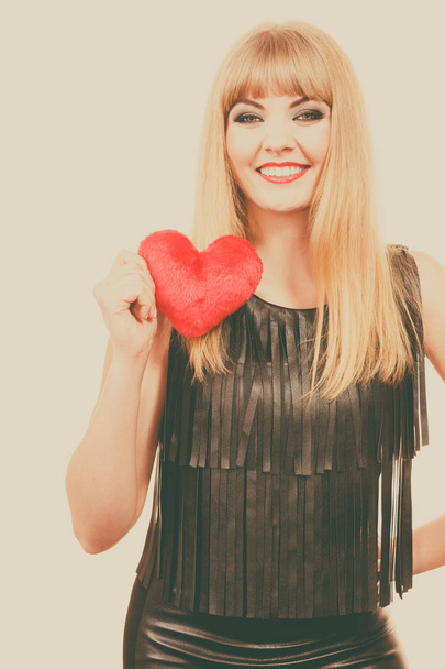 Woman gorgeous girl holding red heart love symbol  - 写真・画像