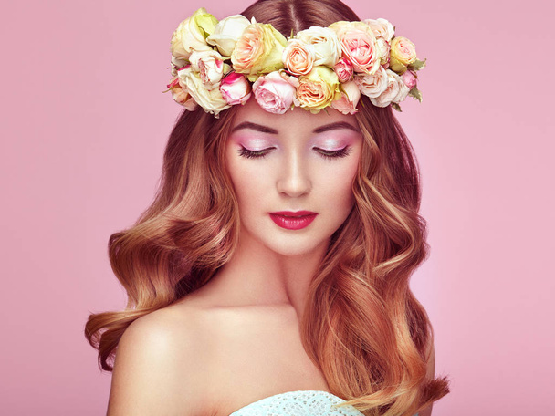 Beautiful blonde woman with flower wreath on her head - Фото, изображение