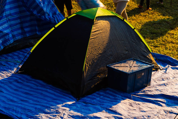 Camping tent on grass while sun rise - Photo, Image