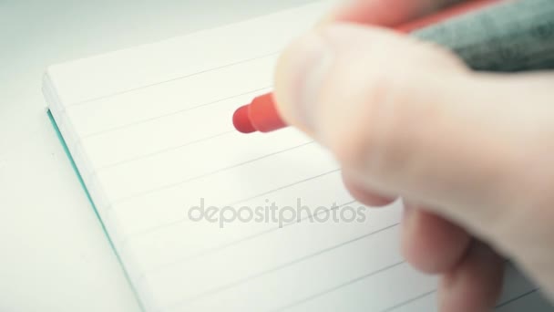 Kézi írás a szót cél a piros marker a Jegyzettömbben - Felvétel, videó