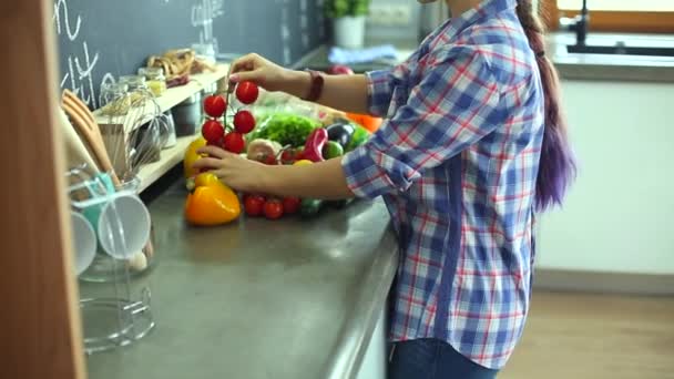 Young woman holding grocery shopping bag with vegetables - Materiał filmowy, wideo