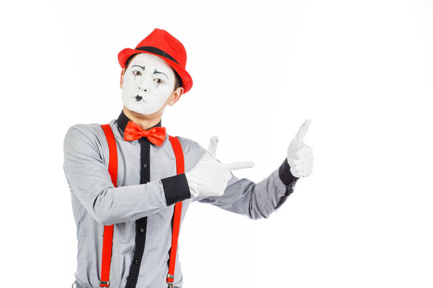 Portrait of a man, artist,clown, MIME. Shows something, isolated - Фото, изображение