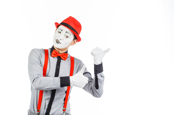 Portrait of a man, artist,clown, MIME. Shows something, isolated - Photo, Image