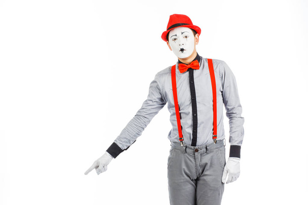 Portrait of a man, artist,clown, MIME. Shows something, isolated - Foto, Imagem