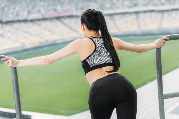 young sportswoman stretching  - Фото, изображение