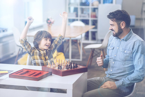 Excited little boy celebrating his chess win - Photo, Image