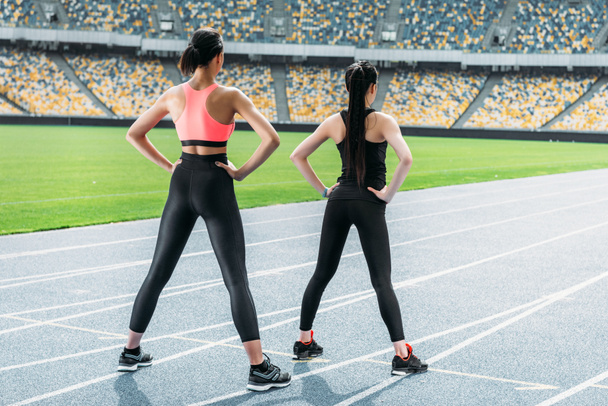 Sportswomen exercising on stadium  - Fotografie, Obrázek