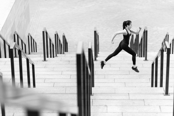 Sportswoman training on stadium stairs  - Fotoğraf, Görsel