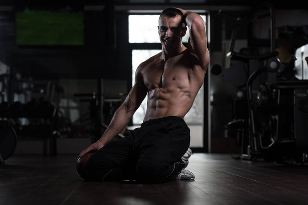 Man In Gym Showing His Well Trained Body - Photo, image