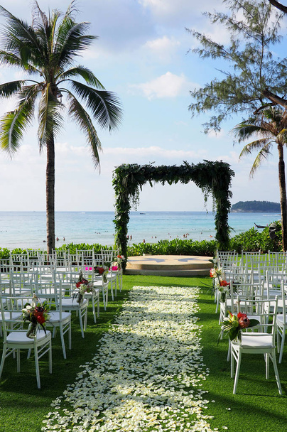Palm trees and chairs at a wedding venue on a tropical island - Photo, Image
