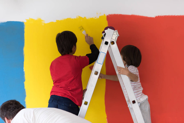 boys painting wall - Photo, Image
