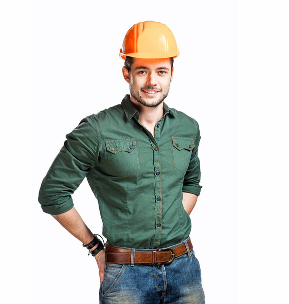 Jóvenes trabajadores de la construcción con sombreros duros
 - Foto, Imagen