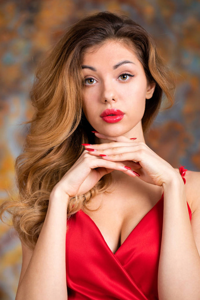 Young beautiful blonde woman in red dress - Photo, Image