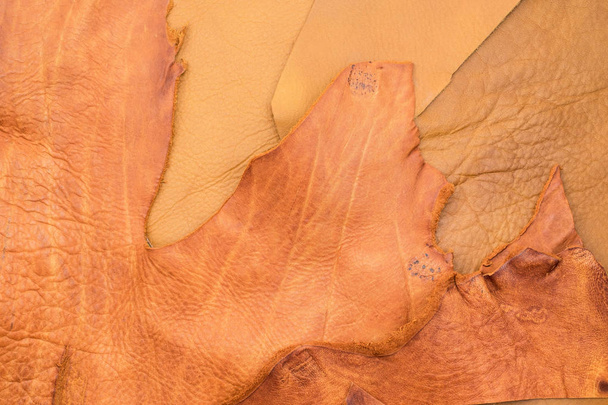 Close up tear tan crumpled leather texture background,fabrics Di - Zdjęcie, obraz