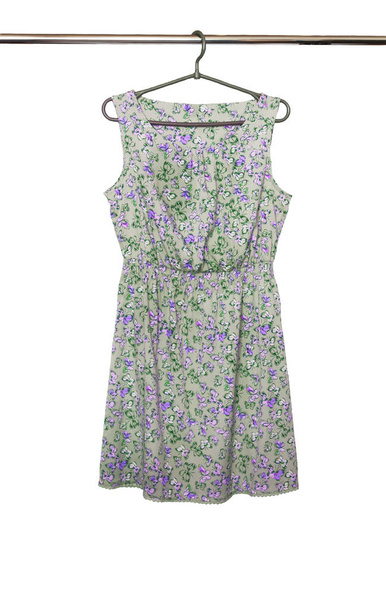 Summer dress with a butterfly pattern hanging on a hanger, isola - Photo, Image